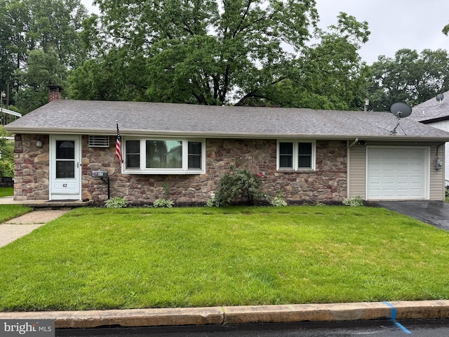 42 Reed St, Mohnton, PA 19540 - single story home with stone siding, a garage, a chimney, driveway, and a front lawn