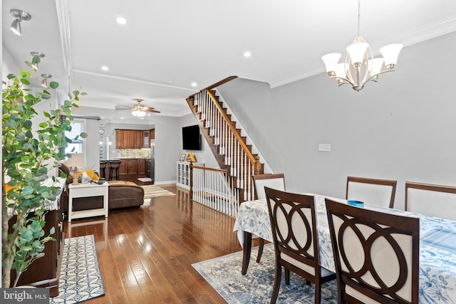 3207 Salmon St, Philadelphia, PA 19134 - dining area featuring stairway, a chandelier, dark wood-style floors, ornamental molding, and recessed lighting