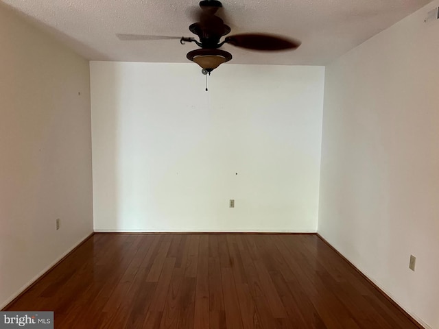 15100 Interlachen Dr Unit 4-701, Silver Spring, MD 20906 - spare room featuring ceiling fan, wood finished floors, and a textured ceiling