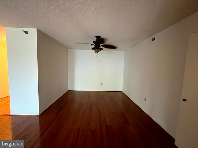 15100 Interlachen Dr Unit 4-701, Silver Spring, MD 20906 - unfurnished room featuring wood finished floors, ceiling fan, and a textured ceiling