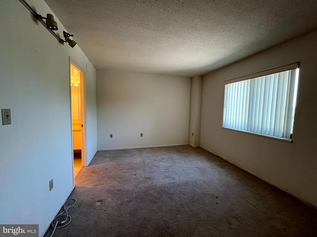 15100 Interlachen Dr Unit 4-701, Silver Spring, MD 20906 - carpeted spare room with a textured ceiling