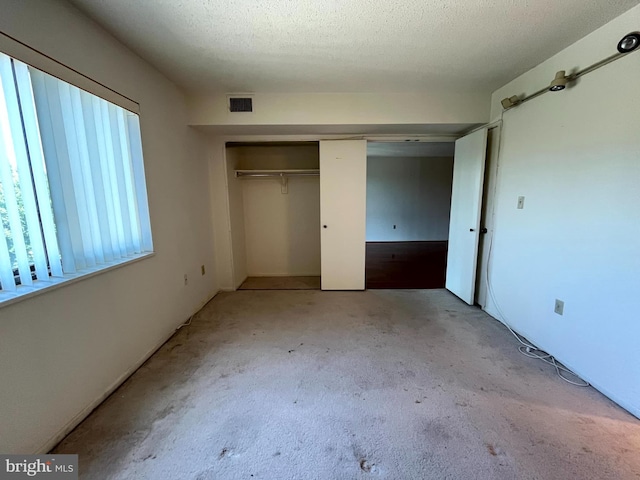 15100 Interlachen Dr Unit 4-701, Silver Spring, MD 20906 - unfurnished bedroom with carpet and a closet