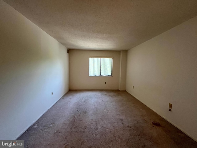15100 Interlachen Dr Unit 4-701, Silver Spring, MD 20906 - spare room featuring carpet and a textured ceiling