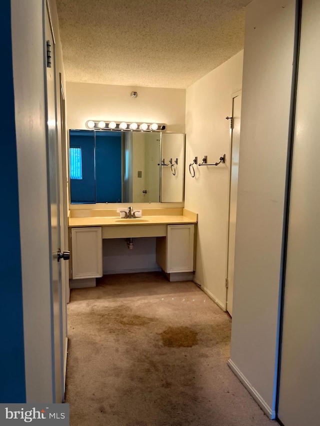 15100 Interlachen Dr Unit 4-701, Silver Spring, MD 20906 - bathroom featuring vanity and a textured ceiling