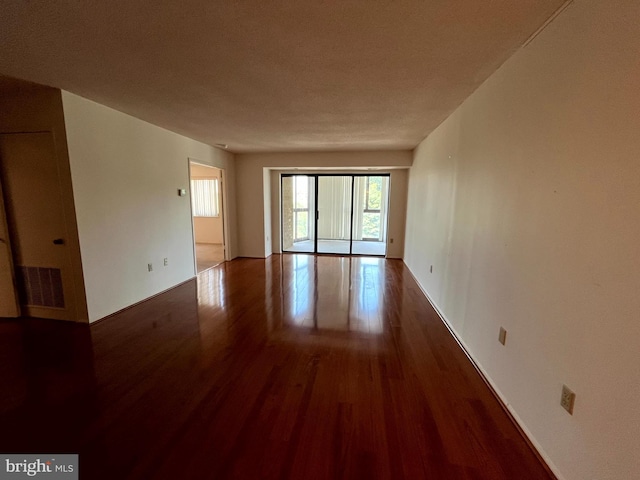 15100 Interlachen Dr Unit 4-701, Silver Spring, MD 20906 - empty room with wood finished floors and baseboards
