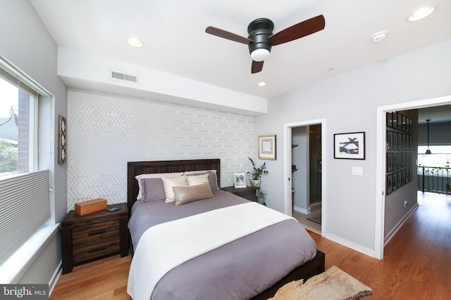 1318 E Eyre St, Philadelphia, PA 19125 - bedroom featuring wood finished floors, an accent wall, recessed lighting, and ceiling fan