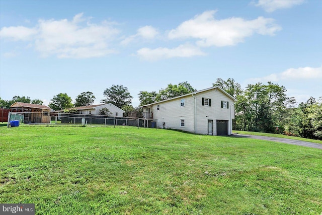 225 Bobby Jones Dr, Etters, PA 17319 - view of yard with driveway and a garage