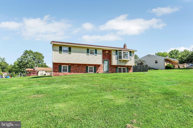 225 Bobby Jones Dr, Etters, PA 17319 - view of front of property featuring brick siding, a chimney, and a front lawn