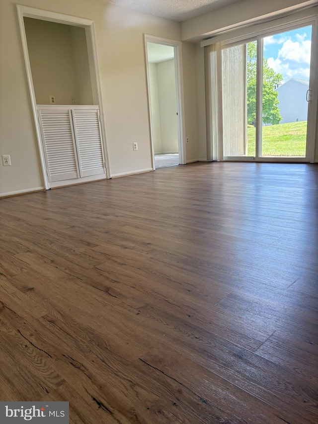 7763 New Providence Dr Unit 54, Falls Church, VA 22042 - unfurnished room with dark wood-style flooring and baseboards