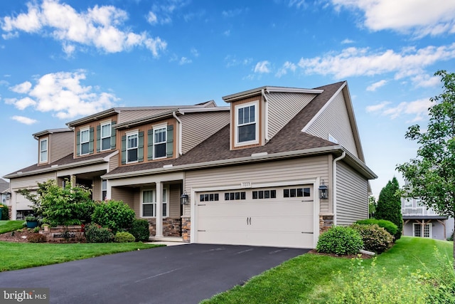 1605 Quincey Dr, Mechanicsburg, PA 17050 - craftsman house with asphalt driveway, a garage, a shingled roof, and a front lawn