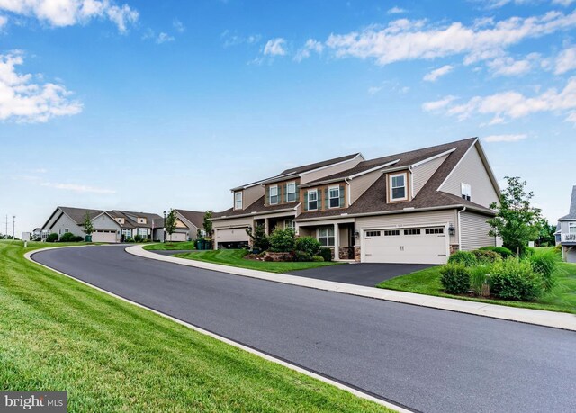 1605 Quincey Dr, Mechanicsburg, PA 17050 - view of front facade featuring driveway, a residential view, a garage, and a front yard