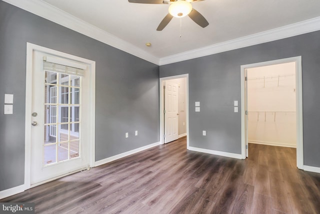 503 Sunset View Ter SE Unit 102, Leesburg, VA 20175 - unfurnished bedroom with ornamental molding, wood finished floors, a walk in closet, and a ceiling fan