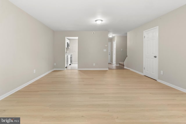 14 Ensign Ct, Essex, MD 21221 - empty room featuring baseboards and light wood finished floors