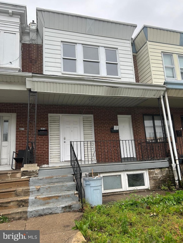 5304 Akron St, Philadelphia, PA 19124 - multi unit property featuring brick siding and a porch