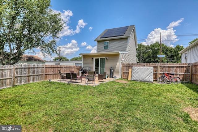 220 Rancocas Rd, Mount Holly, NJ 08060 - back of property with solar panels, a patio area, and a fenced backyard