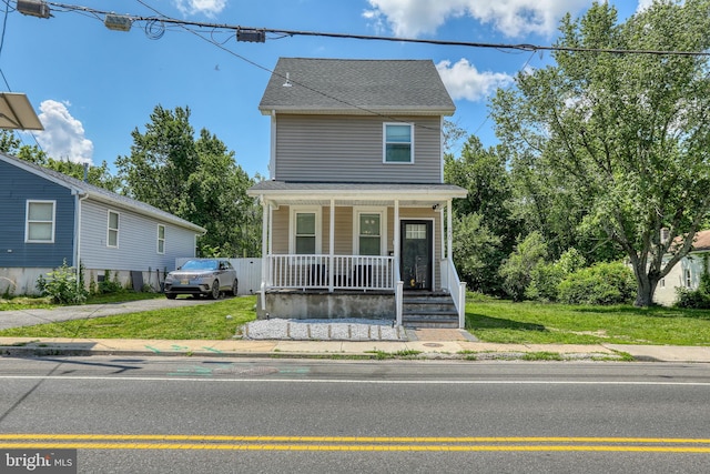 220 Rancocas Rd, Mount Holly, NJ 08060 - traditional style home featuring a porch, a front lawn, and roof with shingles