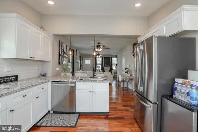 220 Rancocas Rd, Mount Holly, NJ 08060 - kitchen with appliances with stainless steel finishes, a peninsula, light wood-style flooring, ceiling fan, and white cabinetry