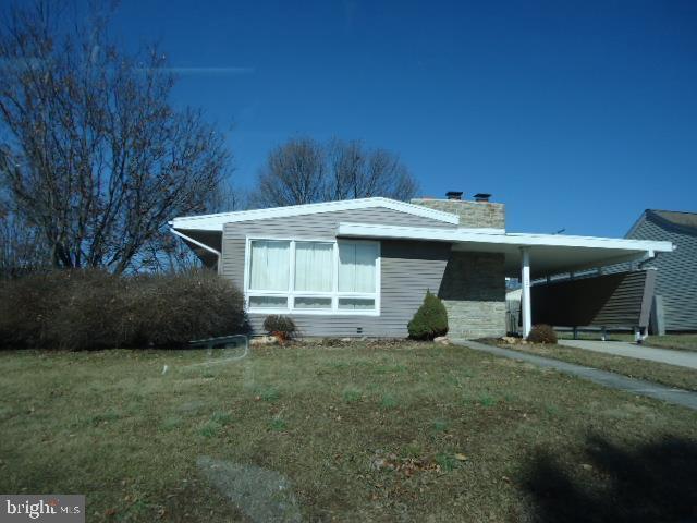 221 Diller Rd, Hanover, PA 17331 - view of front facade featuring a chimney and a front lawn