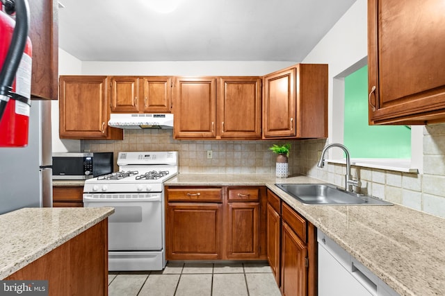 1401 Kenny, Burlington, NJ 08016 - kitchen with appliances with stainless steel finishes, under cabinet range hood, brown cabinets, and tasteful backsplash