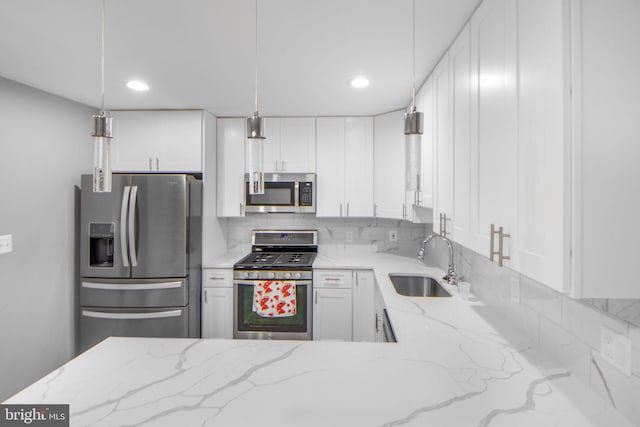 659 Charraway Rd, Baltimore, MD 21229 - kitchen featuring stainless steel appliances, decorative backsplash, white cabinetry, light stone counters, and recessed lighting