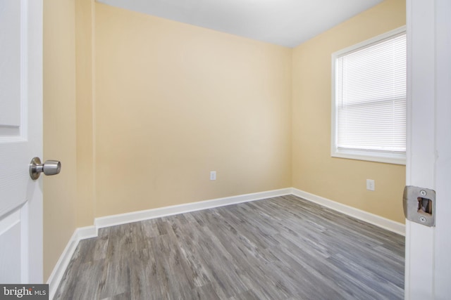 659 Charraway Rd, Baltimore, MD 21229 - spare room featuring wood finished floors and baseboards