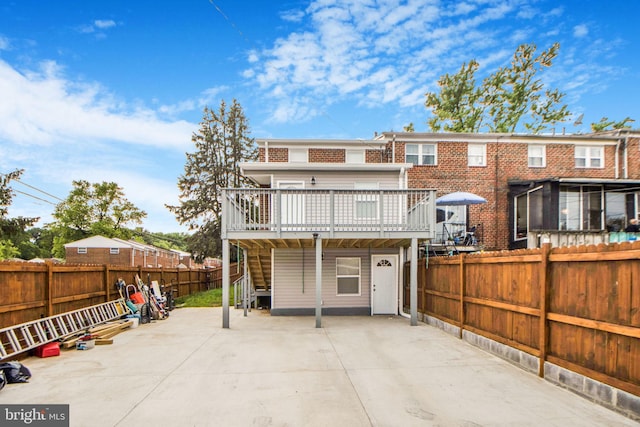 659 Charraway Rd, Baltimore, MD 21229 - rear view of property featuring a deck, stairs, a fenced backyard, and a patio