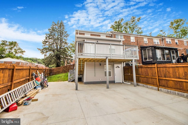 659 Charraway Rd, Baltimore, MD 21229 - rear view of house featuring a deck, a fenced backyard, a patio, and stairs