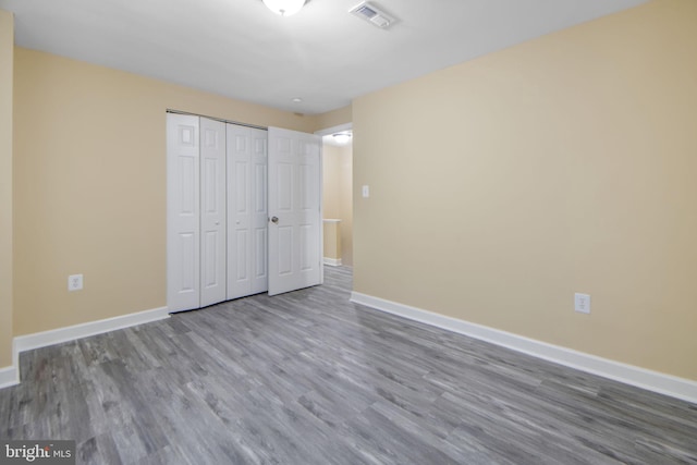 659 Charraway Rd, Baltimore, MD 21229 - unfurnished bedroom with wood finished floors and a closet