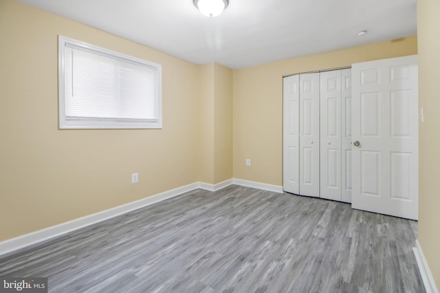 659 Charraway Rd, Baltimore, MD 21229 - unfurnished bedroom featuring wood finished floors and a closet