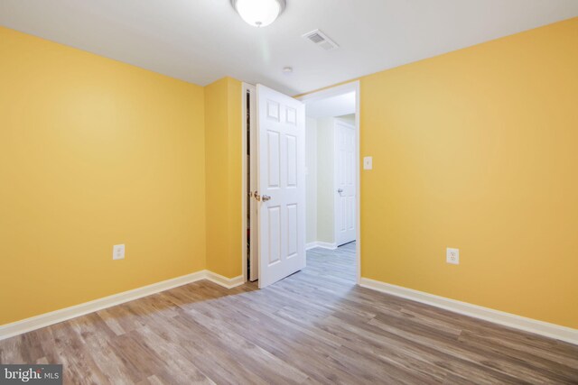 659 Charraway Rd, Baltimore, MD 21229 - spare room featuring wood finished floors and baseboards