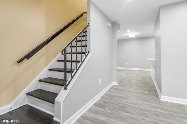659 Charraway Rd, Baltimore, MD 21229 - stairway with baseboards and wood finished floors