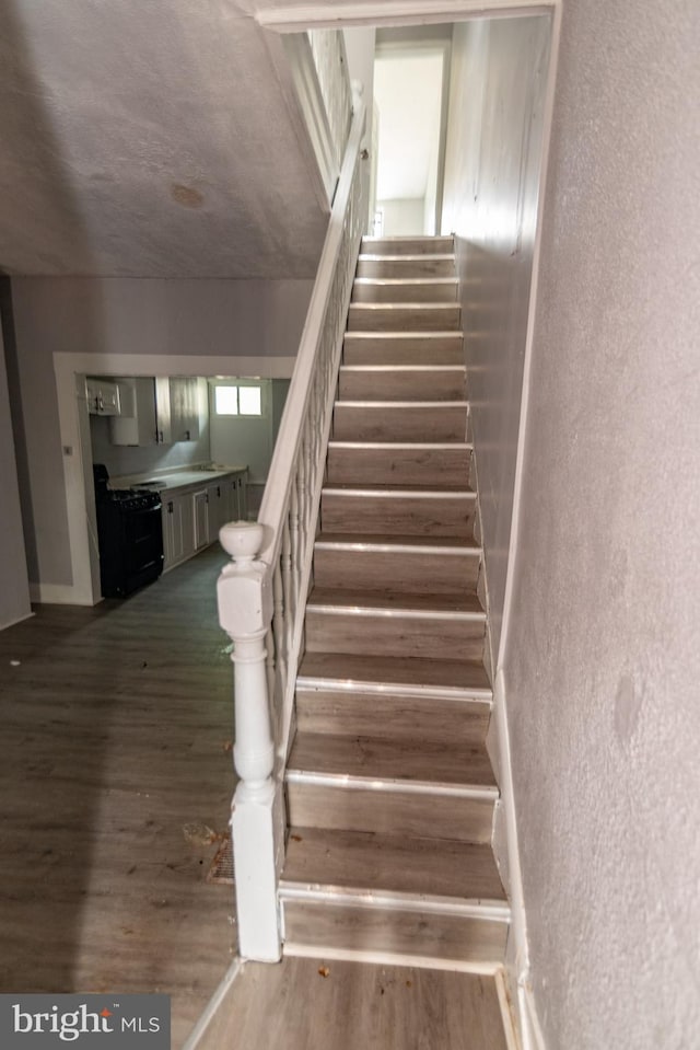 1826 E 28th St, Baltimore, MD 21218 - stairs with wood finished floors