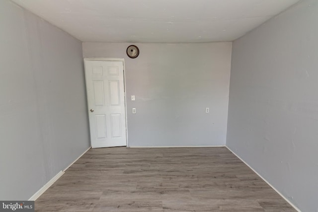 1826 E 28th St, Baltimore, MD 21218 - spare room with wood finished floors