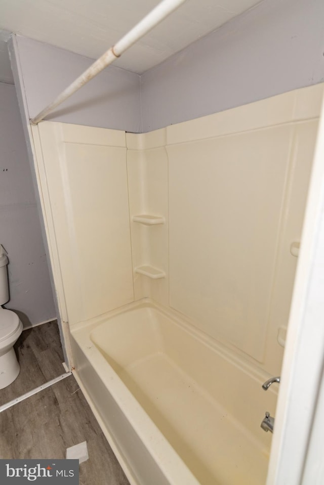 1826 E 28th St, Baltimore, MD 21218 - full bath with wood finished floors and tub / shower combination