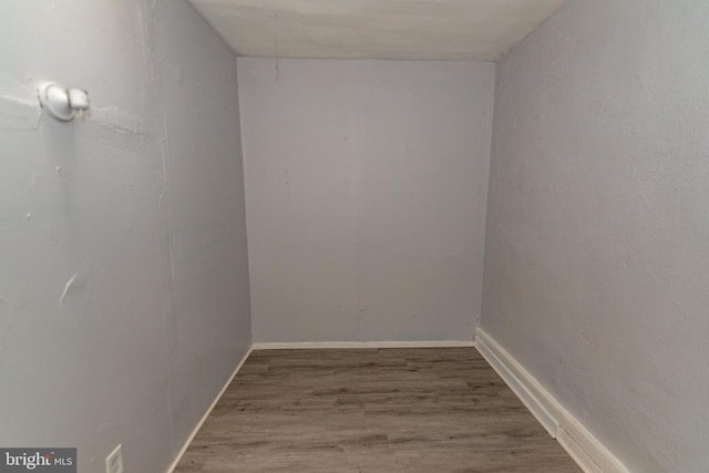 1826 E 28th St, Baltimore, MD 21218 - empty room with wood finished floors and baseboards