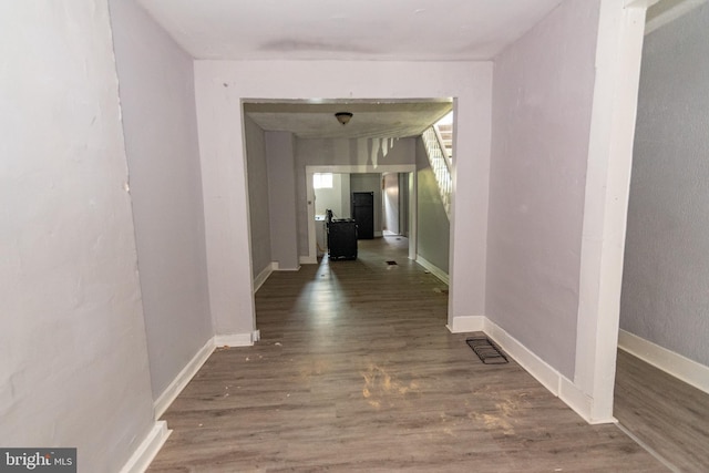 1826 E 28th St, Baltimore, MD 21218 - hallway featuring wood finished floors and baseboards