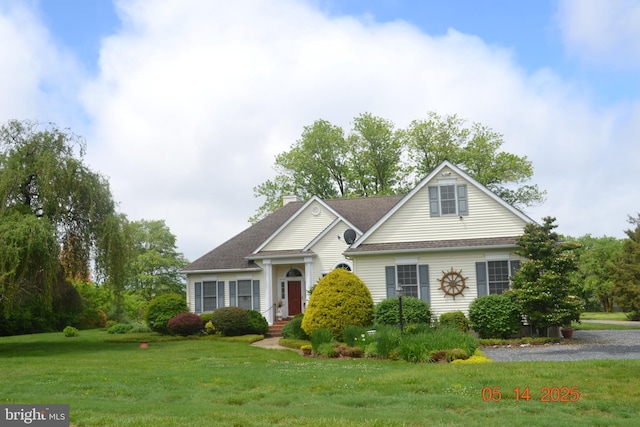 8698 Cummings Rd, Wittman, MD 21676 - traditional-style house featuring a chimney, a front yard, and a shingled roof