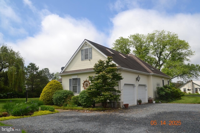 8698 Cummings Rd, Wittman, MD 21676 - view of side of property with gravel driveway and a garage