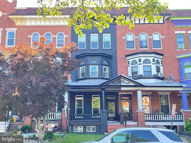 2741 N Calvert St, Baltimore, MD 21218 - view of front of house featuring a porch and brick siding