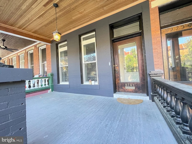 2741 N Calvert St, Baltimore, MD 21218 - doorway to property with a porch and brick siding