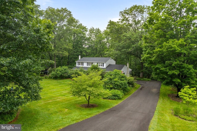 207 Saddle Dr, Furlong, PA 18925 - view of front of home featuring a chimney and a front yard