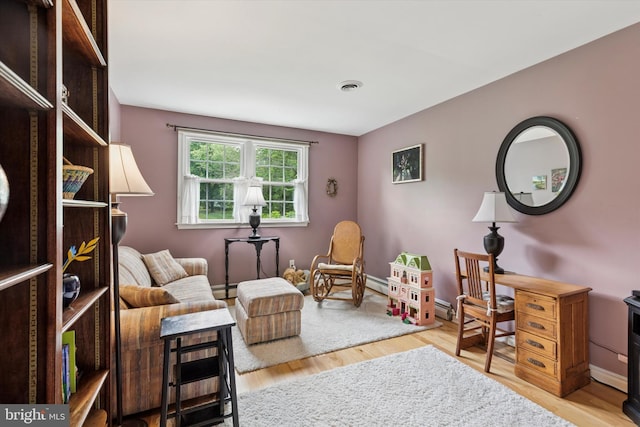 207 Saddle Dr, Furlong, PA 18925 - living area with wood finished floors and a baseboard radiator