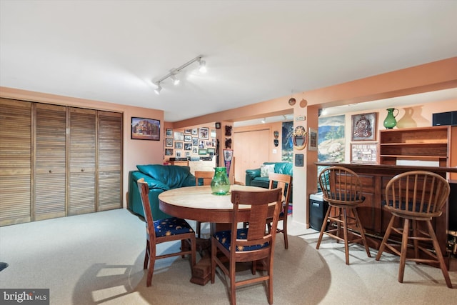 207 Saddle Dr, Furlong, PA 18925 - dining room with a bar, light carpet, and rail lighting