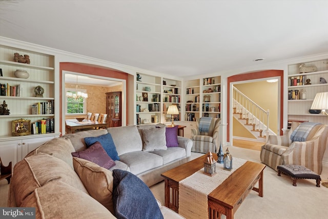 207 Saddle Dr, Furlong, PA 18925 - carpeted living room featuring built in shelves, crown molding, and a chandelier