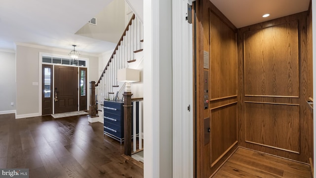 274 W Ashland St, Doylestown, PA 18901 - foyer entrance featuring elevator, crown molding, dark wood-style flooring, stairs, and recessed lighting