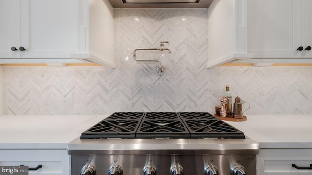 274 W Ashland St, Doylestown, PA 18901 - kitchen featuring range, light countertops, backsplash, and white cabinetry