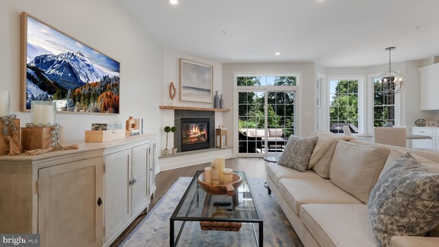 274 W Ashland St, Doylestown, PA 18901 - living area with a glass covered fireplace, recessed lighting, light wood finished floors, and a chandelier