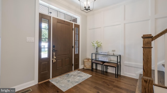 274 W Ashland St, Doylestown, PA 18901 - entrance foyer with dark wood-style floors, ornamental molding, and a chandelier