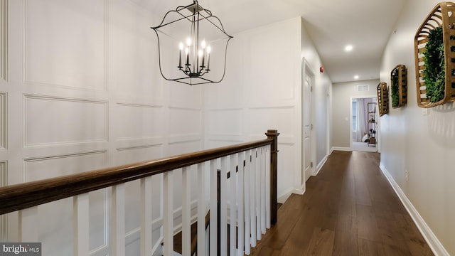 274 W Ashland St, Doylestown, PA 18901 - hallway featuring dark wood-style floors, a decorative wall, a chandelier, and recessed lighting