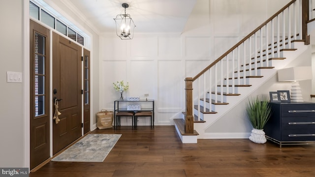 274 W Ashland St, Doylestown, PA 18901 - foyer with stairs, dark wood finished floors, a decorative wall, ornamental molding, and a chandelier